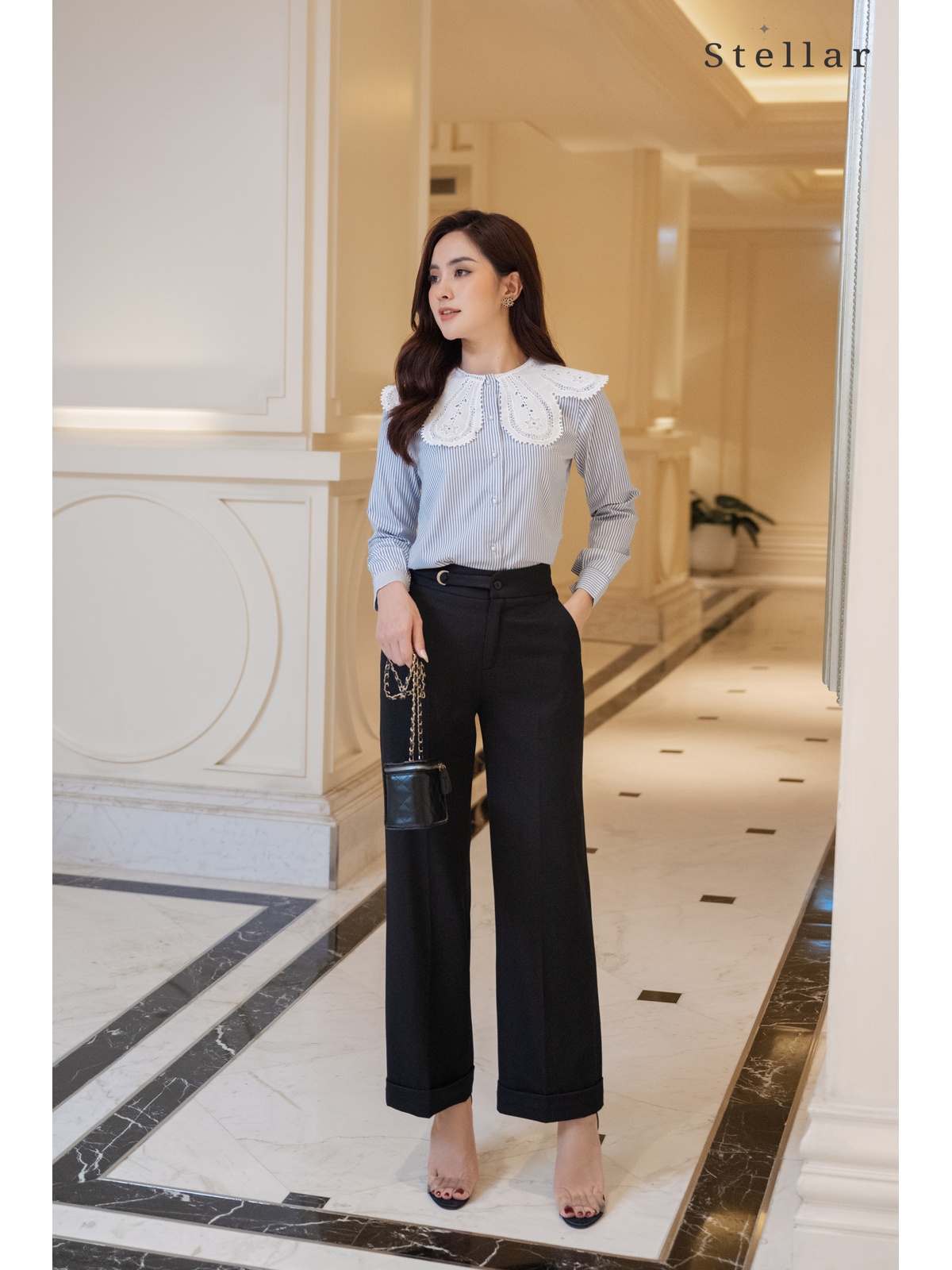 Quần xuông đen, lơ vê gấu, cài khoá vàng