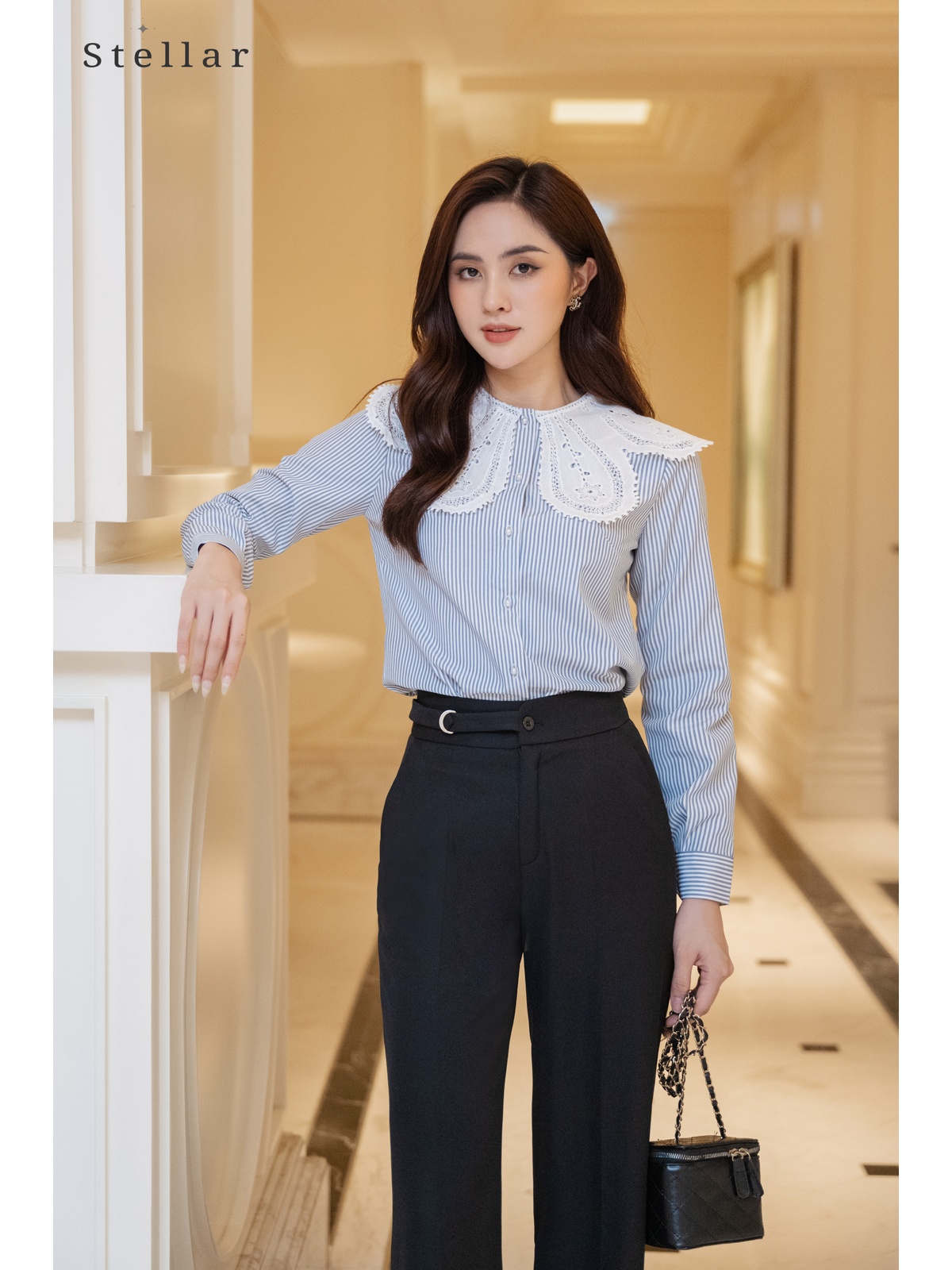 Quần xuông đen, lơ vê gấu, cài khoá vàng